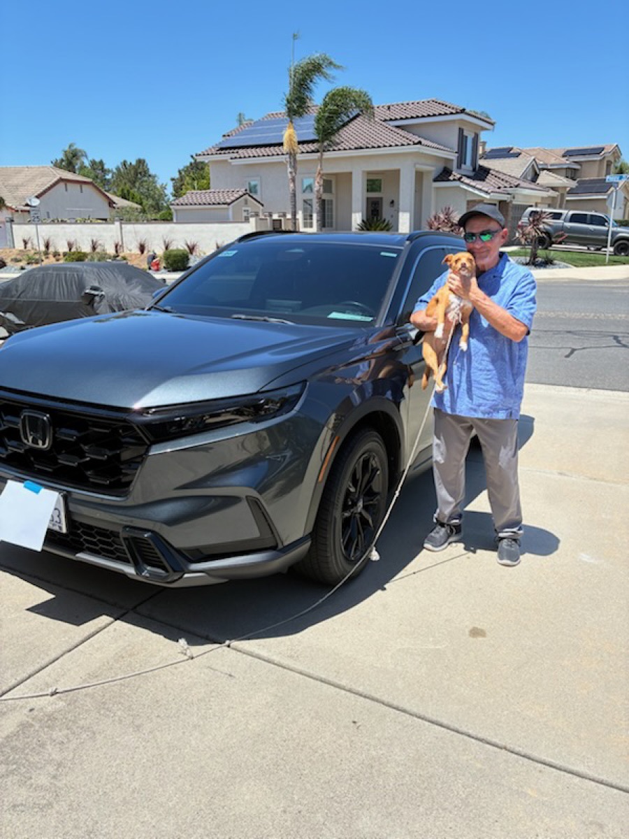 Alan with his dog Max next to his 2023 Honda CR-V